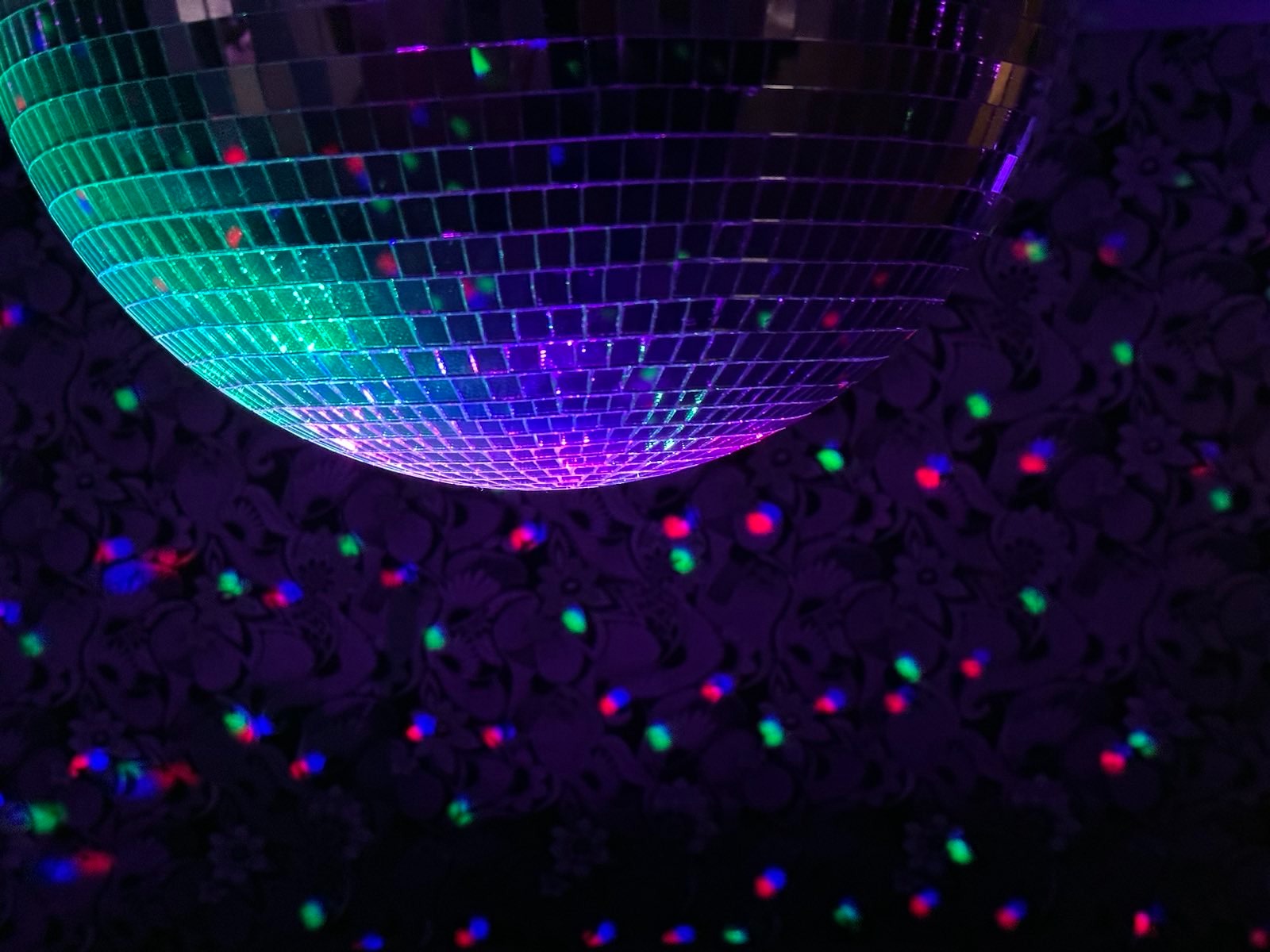 lighted disco ball with some funky wallpaper